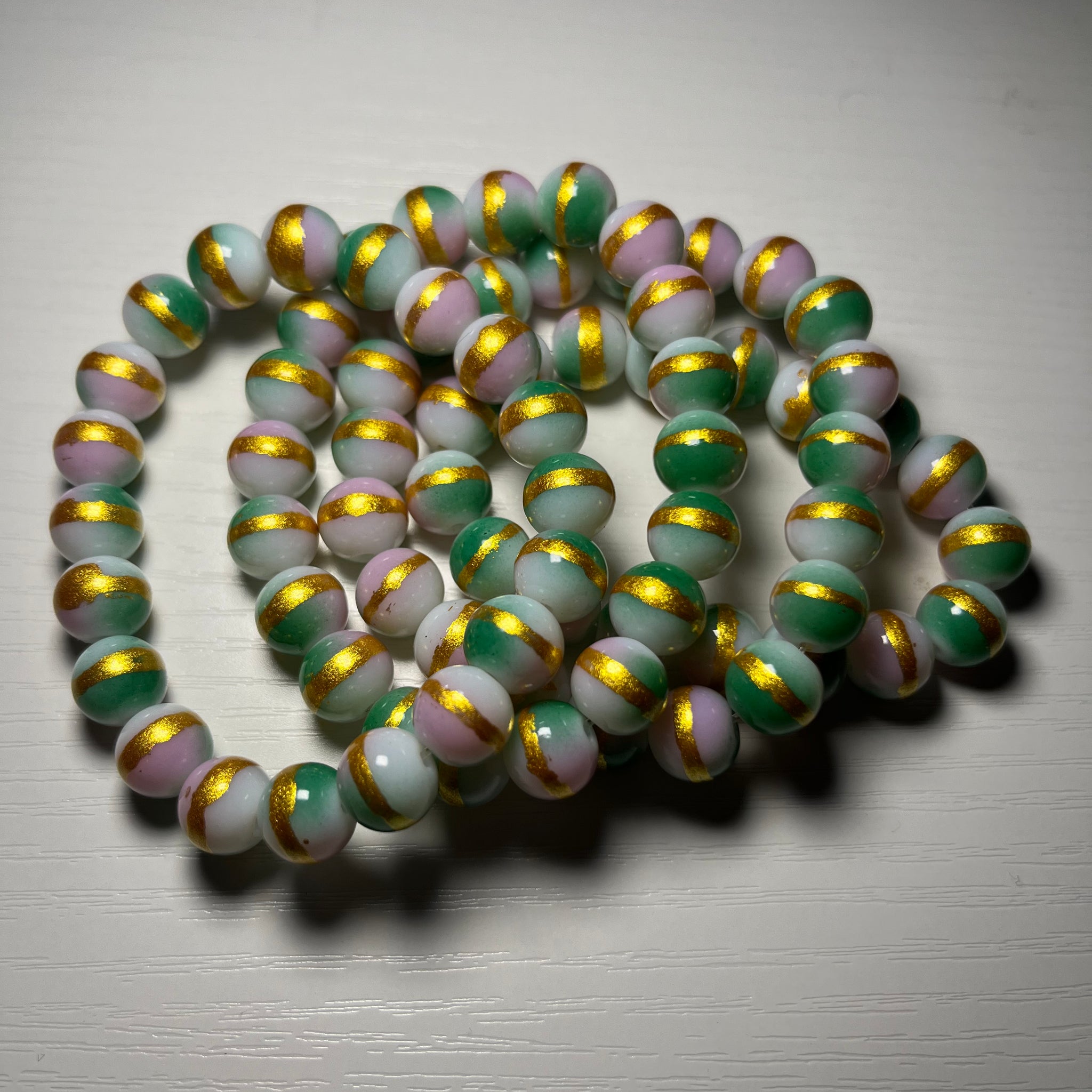 Pink and green beaded bracelets with gold 