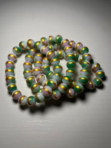 Pink and green beaded bracelets with gold 