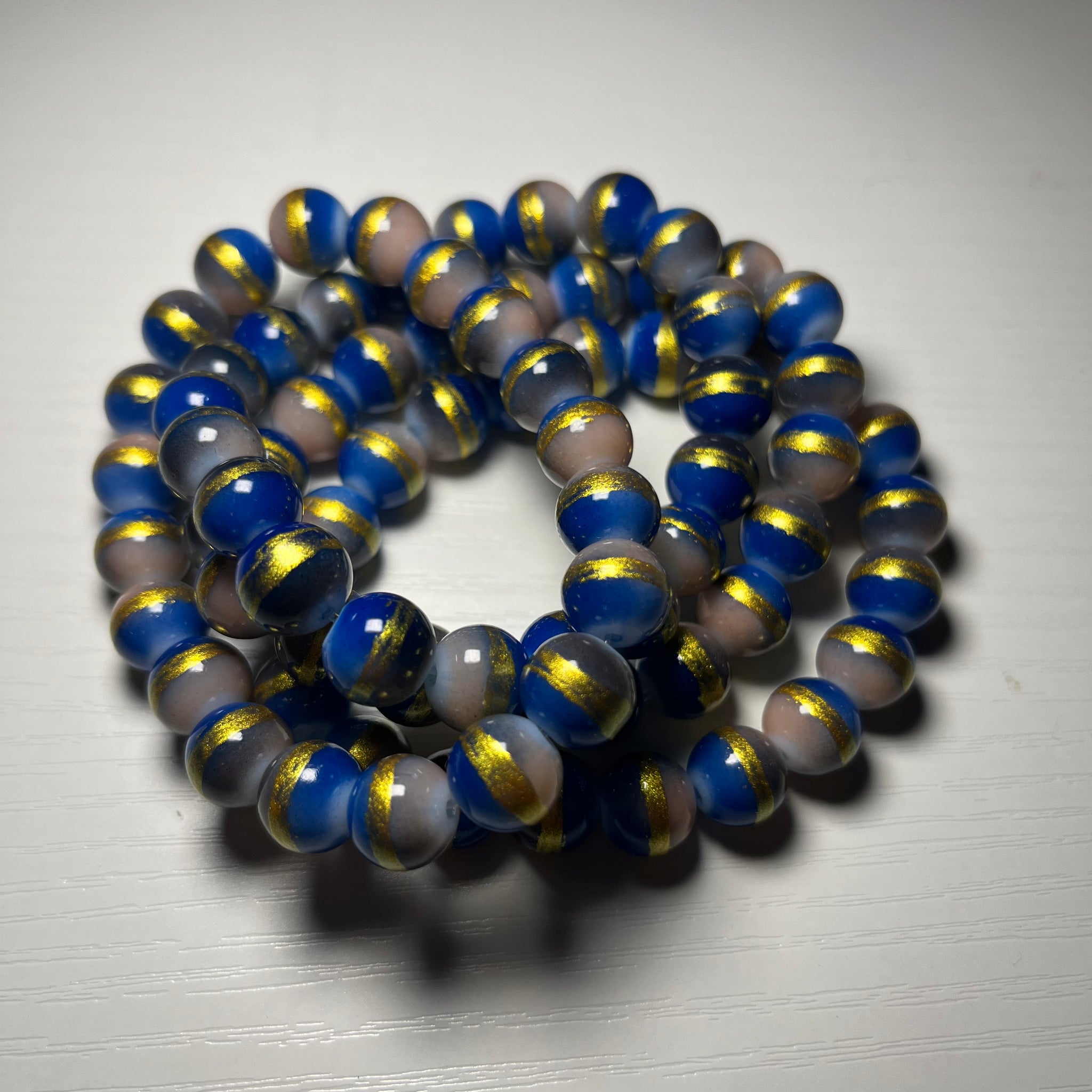 Light blue with gold beaded bracelets