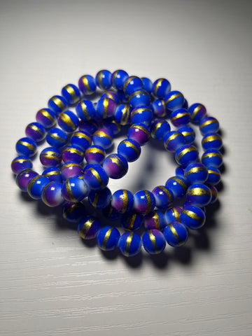 Blue beaded bracelets with gold stripe