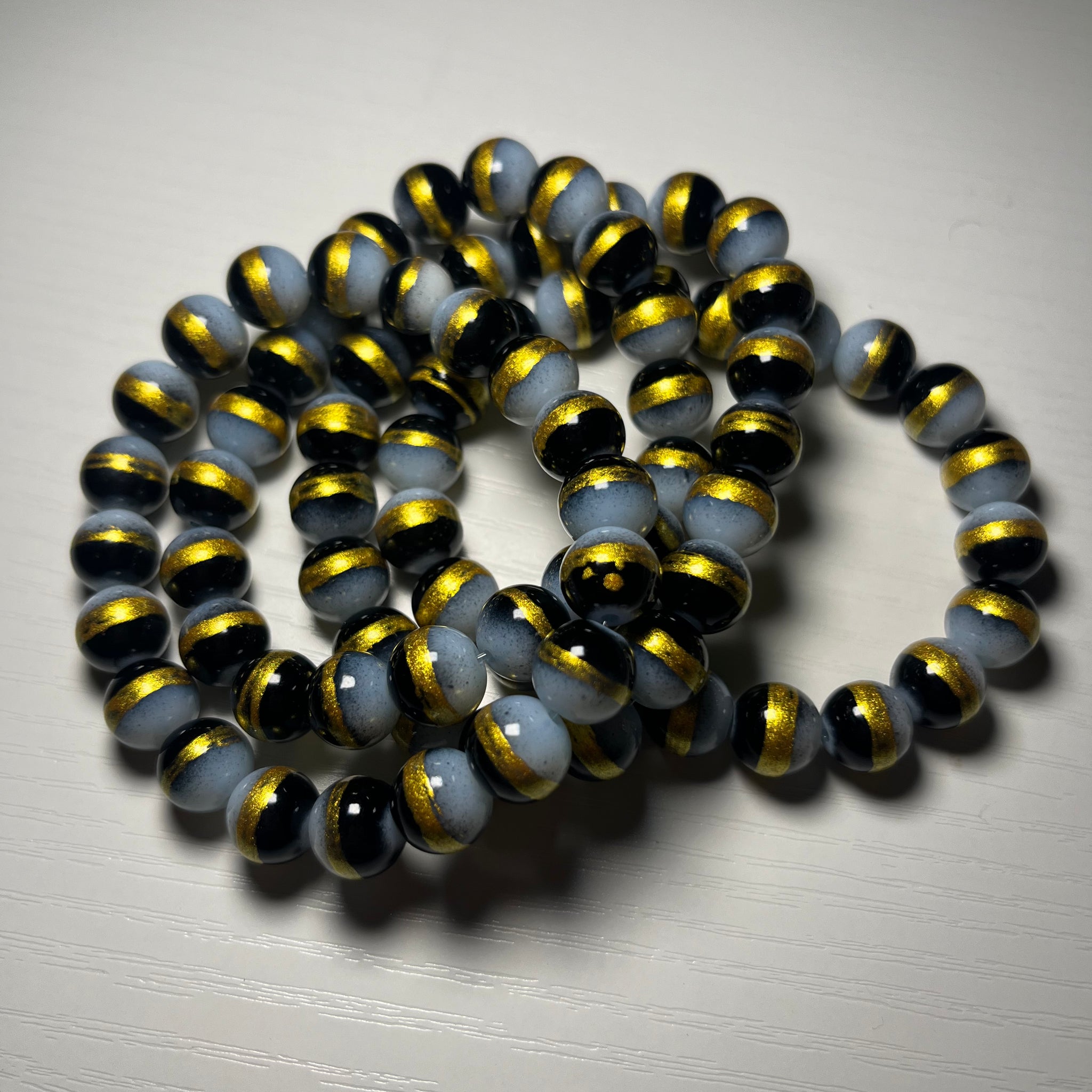 Black beaded bracelets with gold