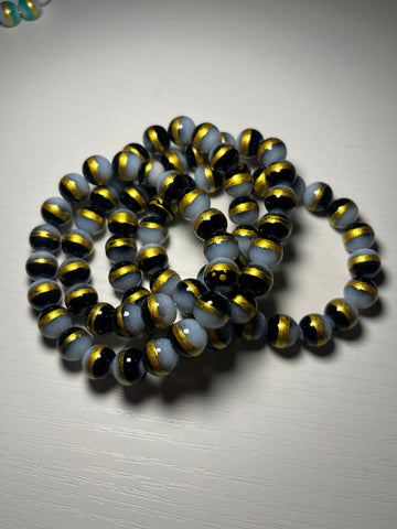 Black beaded bracelets with gold