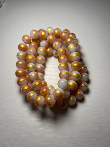 Peach color beaded bracelets with cream and gold