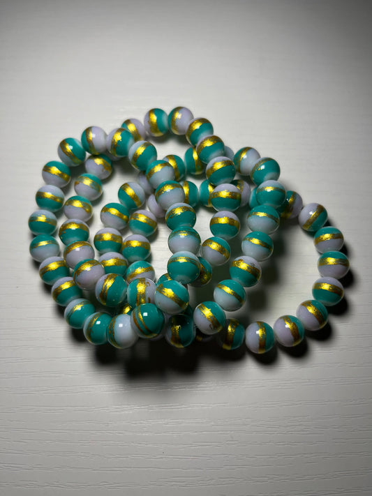 Green beaded bracelets with gold