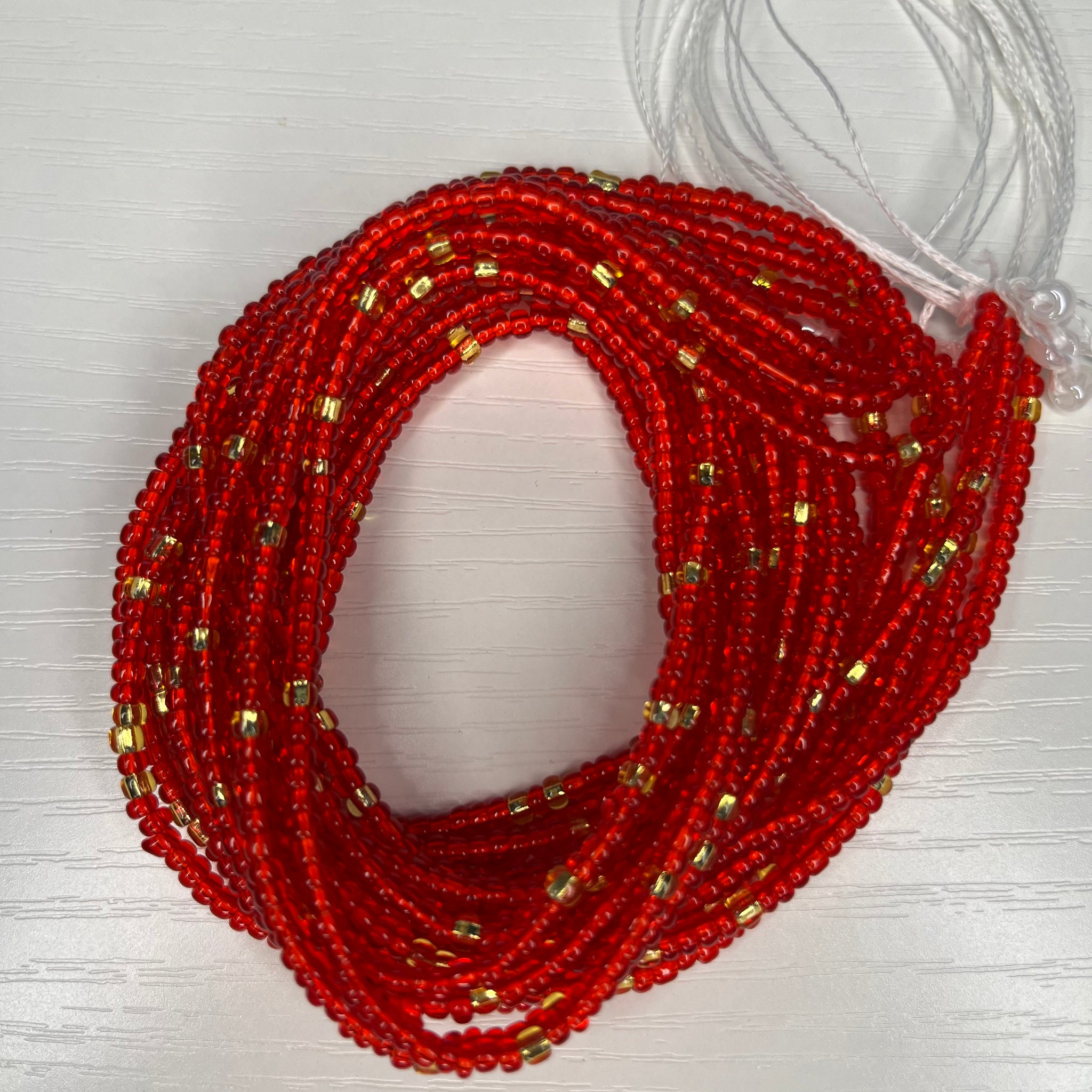 Tequila sunrise inspired red and gold waist beads