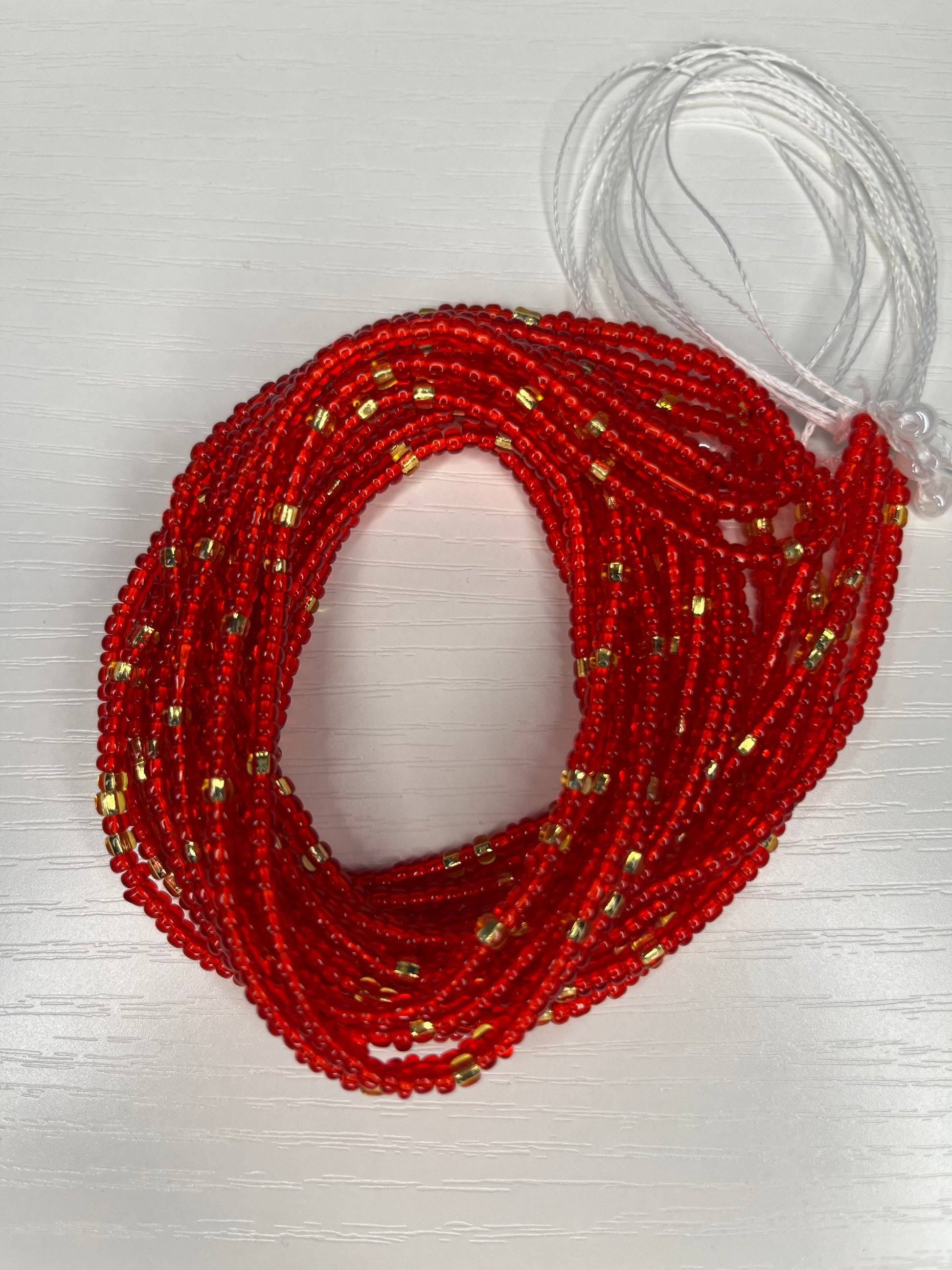 Tequila sunrise inspired red and gold waist beads