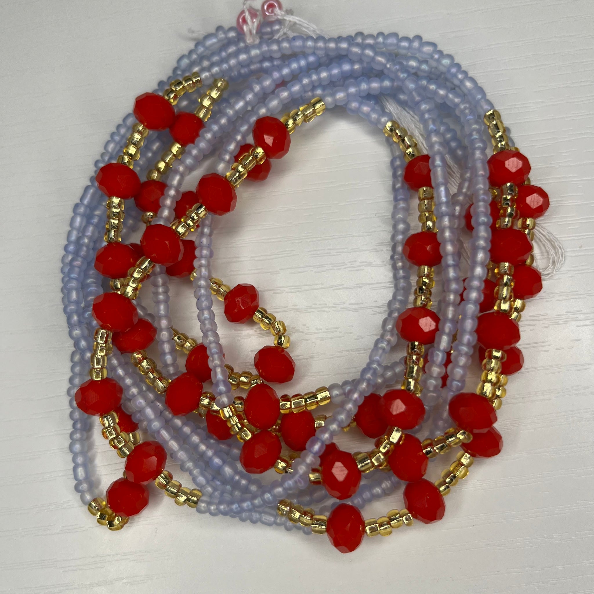 Blue waistbeads with gold and red crystals 