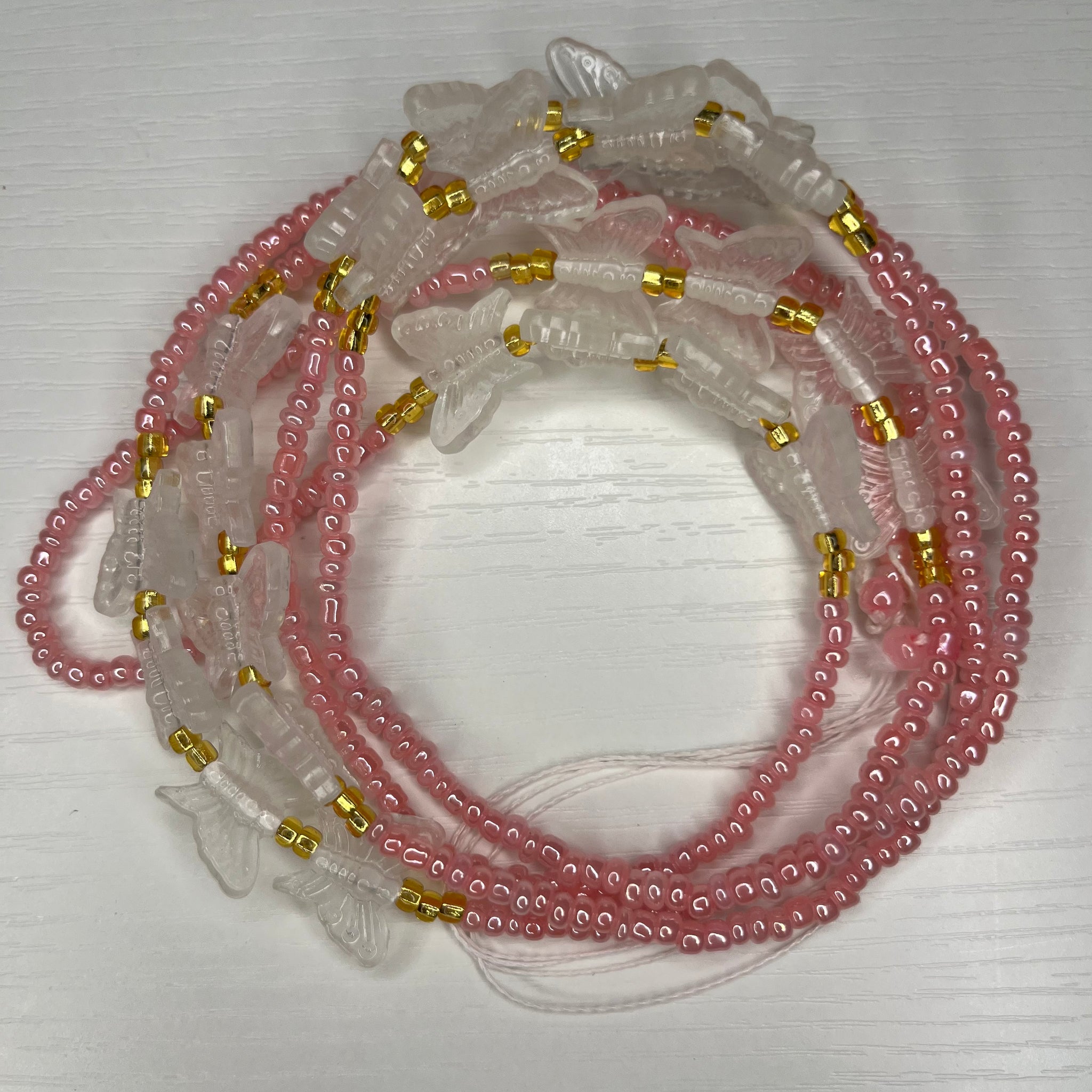 Pink waistbeads with gold and glow in the dark butterflies