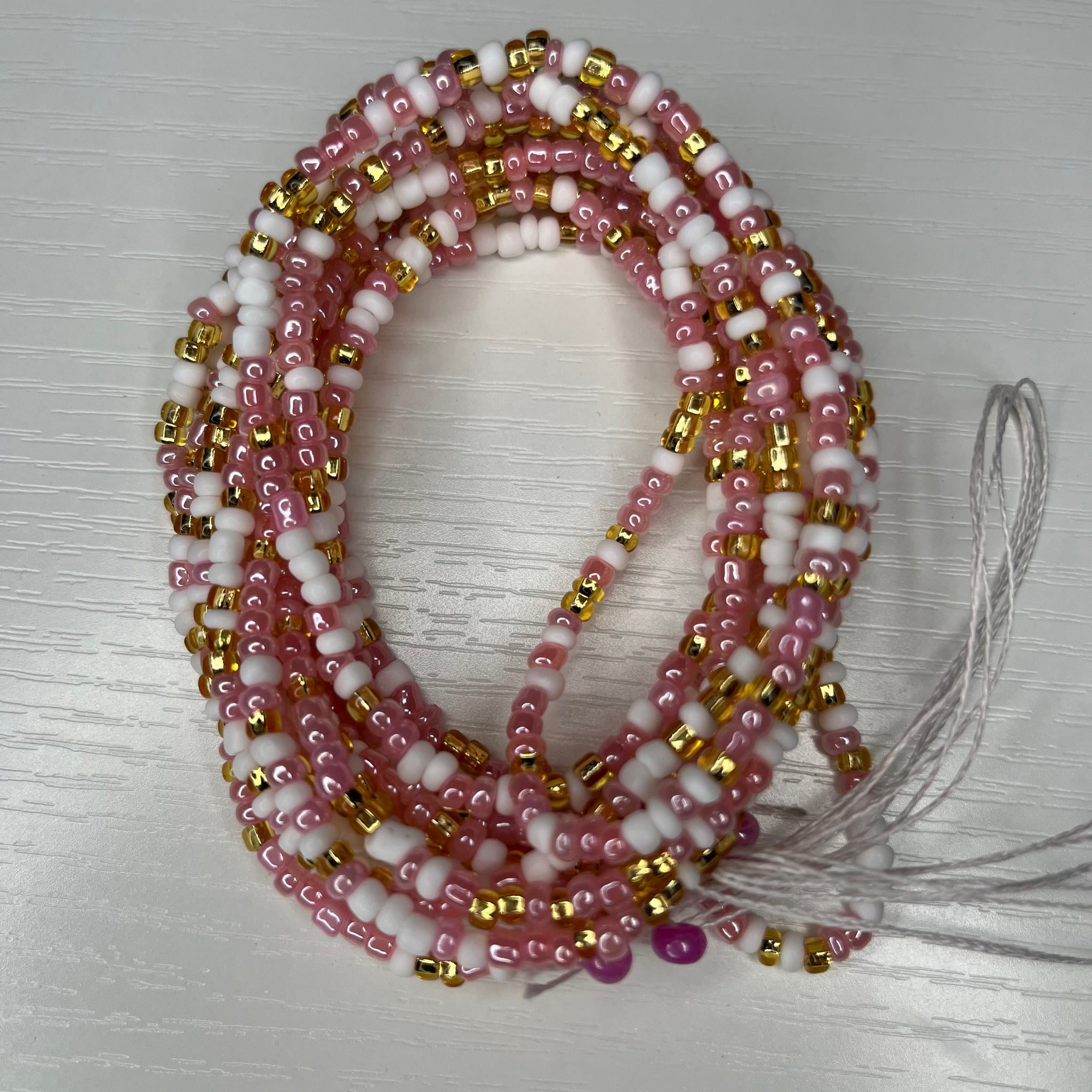 Pink white and gold waistbeads