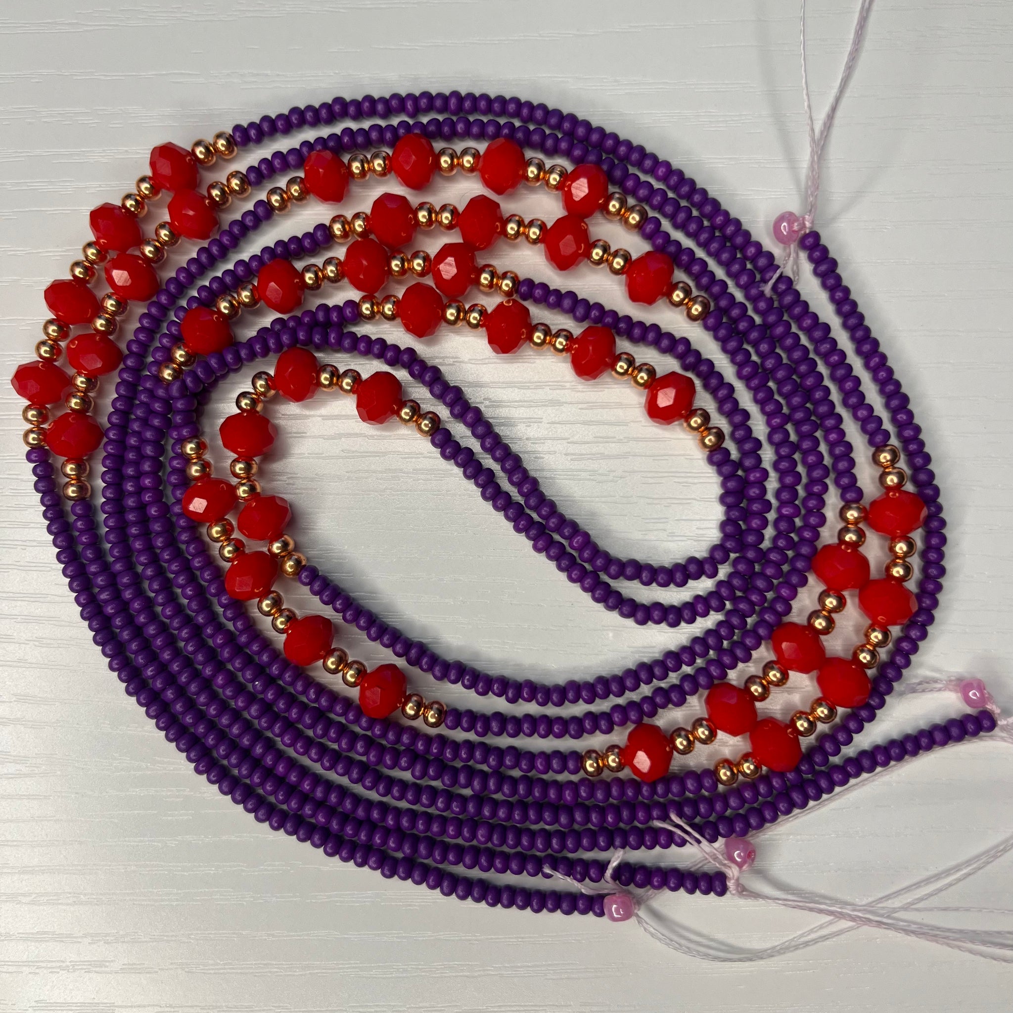 Purple waistbeads with copper and red crystal