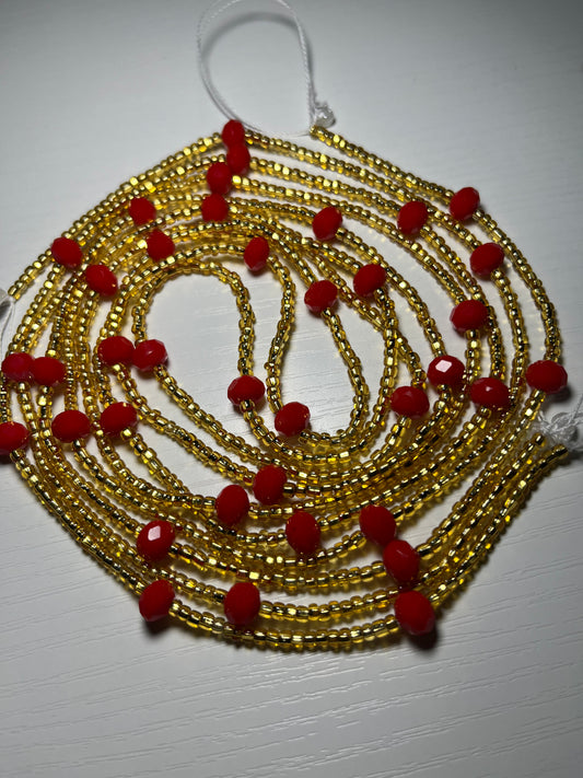 Gold waistbeads with red crystal