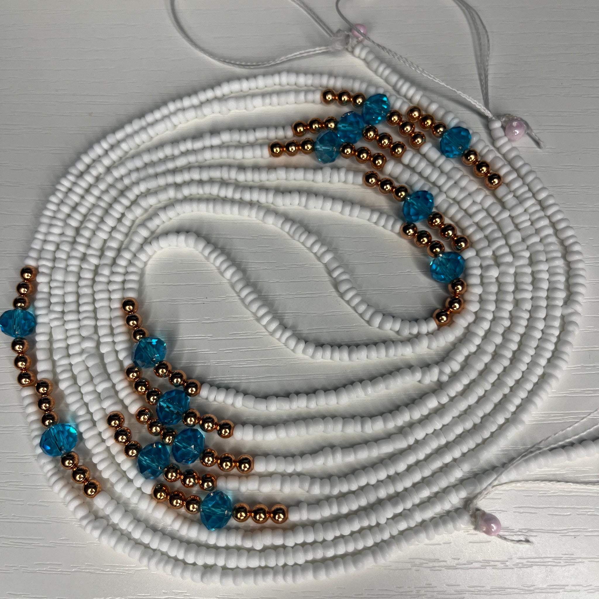 White waistbeads with copper and blue crystals